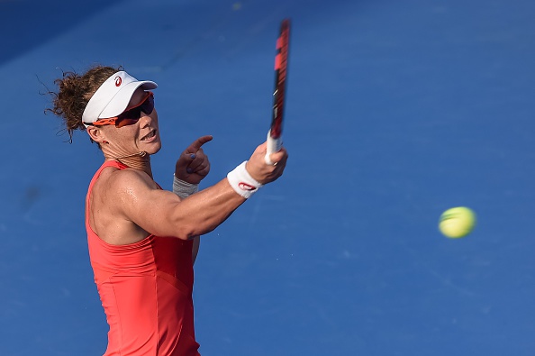 Samantha Stosur of Australia hits a return against Heather Watson of Britain during their women's singles quarter-final match of the WTA Hong Kong Open in Hong Kong on October 16, 2015. AFP PHOTO / Philippe Lopez        (Photo credit should read PHILIPPE LOPEZ/AFP/Getty Images)