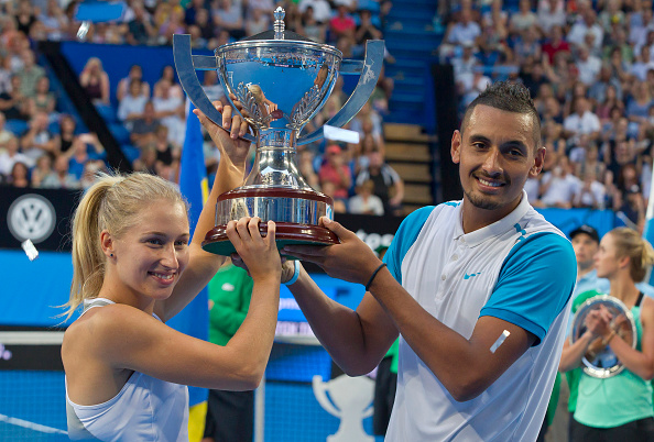 Nick Kyrgios and Daria Gavrilova of the Australia Green team celebrate with the Hopman Cup after defeating Alexandr Dolgopolov and Elina Svitolina of Ukraine during their mixed doubles final match of the Hopman Cup tennis tournament in Perth on January 9, 2016.     AFP PHOTO / Tony ASHBY   -IMAGE RESTRICTED TO EDITORIAL USE - NO COMMERCIAL USE / AFP / TONY ASHBY        (Photo credit should read TONY ASHBY/AFP/Getty Images)